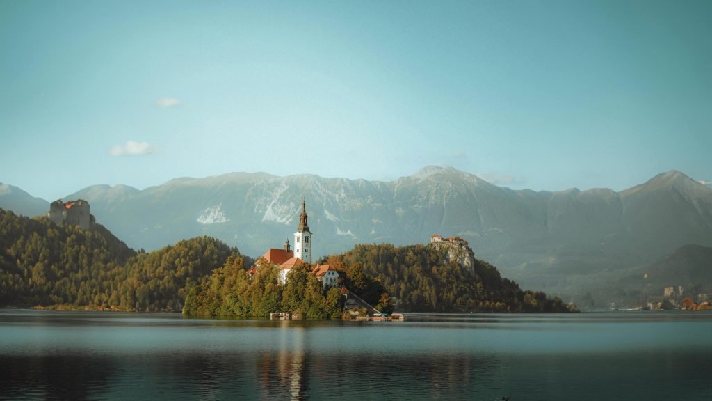Image of a mountain range on a lake in Lake Bled, Slovenia for travel